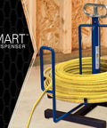 Wire Smart Cable Dispenser Floor Or Stud Mount 3 In 1 Pro Grade Utility displayed with yellow cable on workbench.