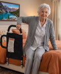 Senior using Dual Handle Bed Rail for Seniors With Padded Grips, Storage Pocket, and 300 Lbs Capacity, Black