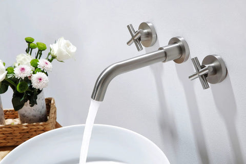 Brushed Nickel Wall Mount Bathroom Faucet With Double Handles Includes Rough In Valve Drip Free Ceramic Disc Cartridge Solid Brass Build Tarnish Resistant No Fuss Install For Modern Sinks mounted above white basin with water flowing