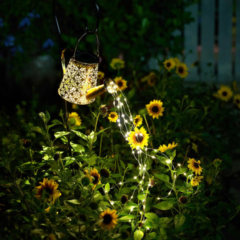 Watering Can Solar Lights With Cascading Glow For Outdoor Vibe Hanging Lantern illuminating garden at night