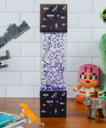 Nether Portal Glitter Motion Lamp LED Light 12-inch on desk with Minecraft decor, official video game collectible.