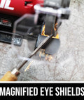 Heavy Duty Eight Inch Bench Grinder Equipped With A Kickass Three Point Zero Amp Motor And Bright Led Work Light Paired With Nifty Water Cooling Tray For Effortless Metal Sharpening Tasks with magnified eye shields in use.