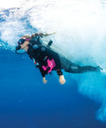Diver wearing Hydros X Front-Adjustable Men's Scuba BCD with Balanced Power Inflator in ocean setting