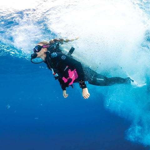 Diver wearing Hydros X Front-Adjustable Men's Scuba BCD with Balanced Power Inflator in ocean setting
