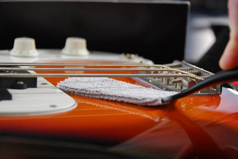 Nomad String Body And Hardware Cleaning Tool For Guitars And Bass Extends String Life, Preserves Tone, And Cleans Strings, Body, And Hardware In Seconds With A Premium Microfiber Pad No Cleaning Solution Needed on orange guitar strings