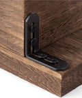 10 Pack Tough As Nails Black Corner Brackets Rock Solid Stainless Steel Shelf Connectors For Heavy Furniture Reinforcement close-up of a bracket.