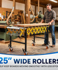 Rock Solid Heavy Duty Adjustable Roller Conveyor 1000 Lb Capacity 25 Inch Wide Stainless Steel Rollers in workshop with wood slabs.