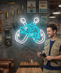 Ice Blue Crossed Fish Hook Neon Sign LED Light Dimmable Wall Decor For Tackle Shops Yachts Man Caves And Fishing Rooms A Dope Gift For Dads Who Live To Fish 17.6 By 13.6 Inches displayed on a wall with fishing decor and a person holding a rod.