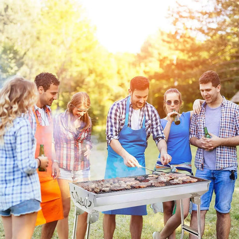 Group of people grilling food outdoors with Portable Stainless Steel Charcoal Grill Folding Outdoor Barbecue Kit for family fun