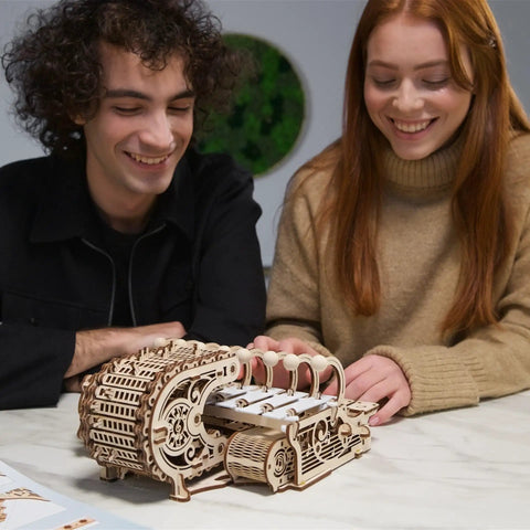 Mechanical Celesta Wooden Puzzle Kit For Adults, 3D DIY Musical Instrument That Doubles As A Functional Mini Piano, Music Box And Xylophone Brain Teaser, 4.7 Inch Tall Wood Model; couple assembling it