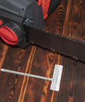 Heavy Duty Four Piece Chainsaw Wrench Socket Set With Bar Adjustment Tool, ergonomic grip, chainsaw and adjustment tool on wooden surface.