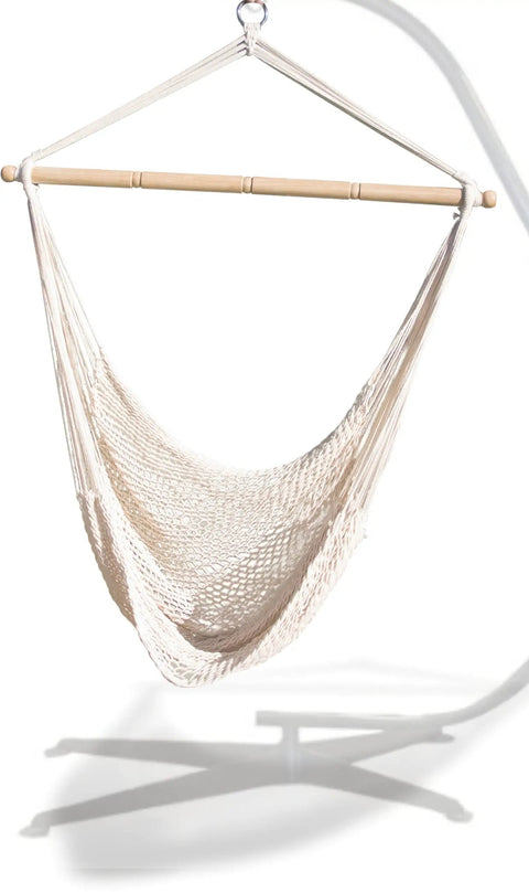 Chill Out Hammock Net Chair With Breathable Cotton Netting No Assembly Needed Conforms To Your Body For Maximum Comfort 220 LB Weight Capacity Indoor Outdoor Rope Lounge Seat hanging from a stand.