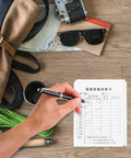 Hand marking an Equipment Inspection Cards Pack 20 Sets With Waterproof PVC Sleeve Safety Tags For Industrial Maintenance And Scaffold Inspections.