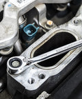Mechanic using Beefy Thirteen Piece SAE Reversible Ratcheting Wrench Set with 12 Point Box Ends on engine part