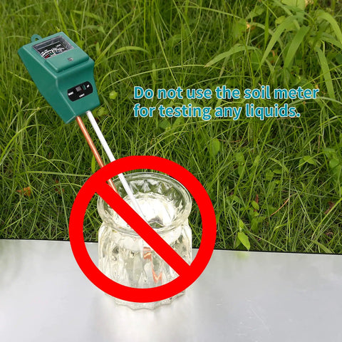 Image of a 3 In 1 Soil Moisture Light And PH Tester with a green case, warning against using it to test liquids, outdoors on grass.