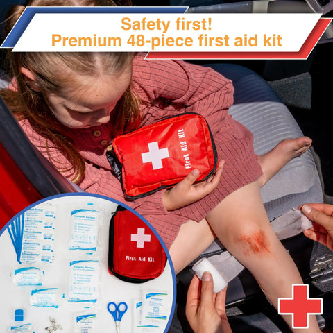 Ultimate Car Emergency Kit With Air Compressor And Heavy Duty Jumper Cables First Aid Tow Strap Tire Gauge And Headlamp displayed next to a child using a first aid kit for a scraped knee.