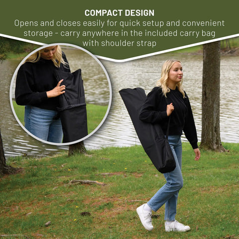Woman carrying Portable Hammock Camping Chair With Stand in a black carry bag by a lake
