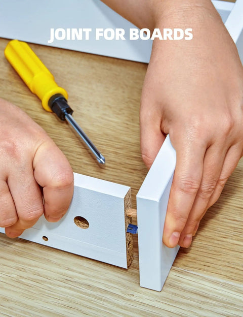 Hand using a screwdriver to secure Top Rated Furniture Cam Lock Screws And Connectors M6 X 40mm Zinc Plated Steel Build.