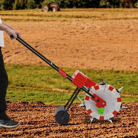 Handy Manual Seeder With Seven Nozzles And A Smooth Hand Push Roller for garden planting in use on soil