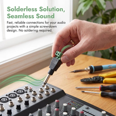 Hand connecting a Straight Up 1/4 Inch Jack Mono Male Plug to a stage mixer, showcasing solderless audio connection.