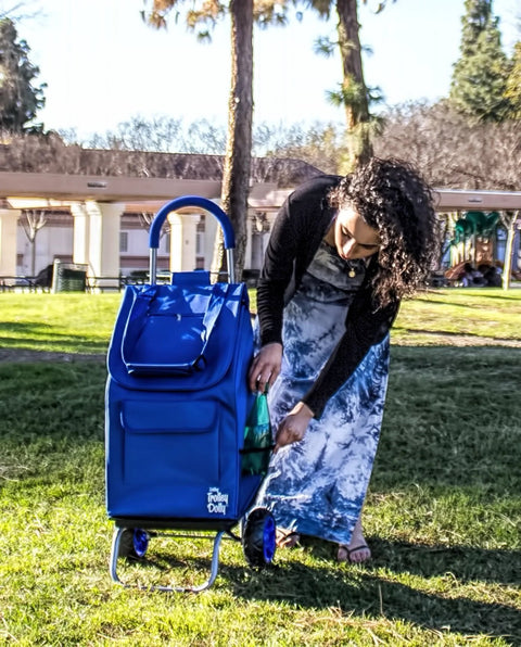 Woman using Foldable Trolley Dolly Shopping Cart For Groceries With Heavy Duty Wheels And Removable Bag in a park