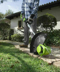 Person using Weed Eater Bladed Trimmer Head With Fixed Dual Blades For Ryobi 18V 24V And 40V Trimmers Fits RY40210