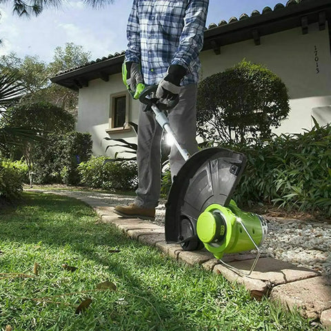Person using Weed Eater Bladed Trimmer Head With Fixed Dual Blades For Ryobi 18V 24V And 40V Trimmers Fits RY40210