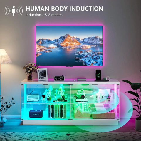 Glass Display Cabinet With Charging Station And RGB Lighting 59 Inch in a living room with decoration and electronics