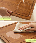 Top Shelf Wooden Cutting Boards For Kitchen Meal Prep And Serving With Deep Juice Groove and Sturdy Handles shown being washed with water.