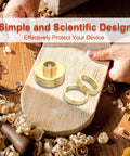 Close-up of brass router template bushing set with centering cone and multiple bushings on a wooden board