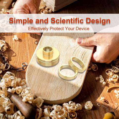 Close-up of brass router template bushing set with centering cone and multiple bushings on a wooden board