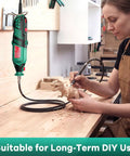 Heavy Duty 8000 To 35000 Rpm Rotary Tool Kit in use, carving a wooden dinosaur figure, equipped with flex shaft.