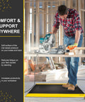 Industrial 15/16 Inch Extra Thick Anti Fatigue Floor Mat Built For Heavy Duty Jobs, Diamond Plate Non Slip Ergonomic Standing Mat In Black With Yellow Edge, Perfect For Workbench, Shop, Kitchen, Warehouse 3 By 5 Feet under worker using a saw