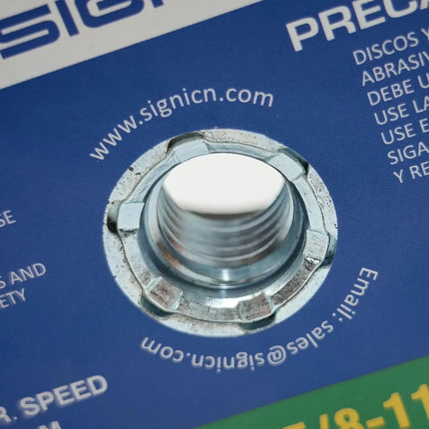Close-up of the threaded arbor on the Green 4 Inch Grinding Stone For Angle Grinder, 120 Grit Abrasive Wheel packaging.