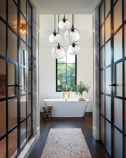 Hand Blown Glass Pendant Lights Over Kitchen Island With Seeded Bubbles Globe Lamp in modern rustic bathroom setting