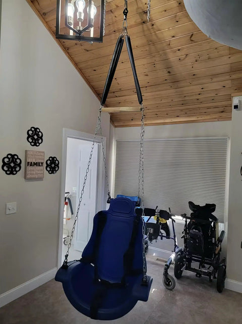 Room with a blue swing chair setup showcasing Beefy Industrial Strength Swing Swivel with Frictionless 360 Degree Eye To Eye Rotation.