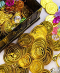 Open pirate treasure chest toy with coins and gems scattered, perfect for kids' adventure and imaginative play.