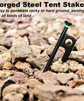 24 Pack Tent Stakes 12 Inch Heavy Duty Forged Steel Stakes That Are Tough As Nails in rocky ground with fluorescent ring