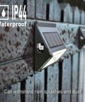 Upgrade Solar Step Lights 12 Pack Outdoor LED Deck Lights With Side Button Design waterproof on a wooden fence in rain