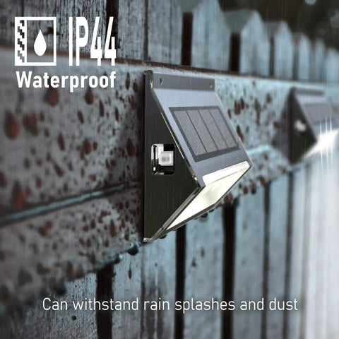 Upgrade Solar Step Lights 12 Pack Outdoor LED Deck Lights With Side Button Design waterproof on a wooden fence in rain
