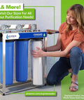 Woman showcasing water filtration system with One Year Reverse Osmosis Filter Kit With Eleven Filters And 100 GPD Membrane