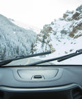 Tough As Nails Silicone Wiper Blade Replacement 26 Inch Premium Beam Design on snow-covered windshield in mountainous region.