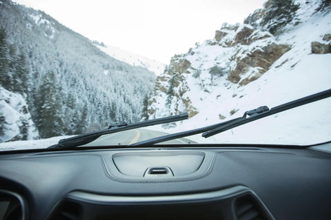 Tough As Nails Silicone Wiper Blade Replacement 26 Inch Premium Beam Design on snow-covered windshield in mountainous region.