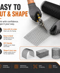 Person cutting Built Like A Brick 1/2 Inch Hardware Cloth Tough As Nails Chicken Wire Fencing Roll for custom shapes.