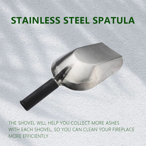 A stainless steel spatula with black handle displayed on a textured surface with shadow.