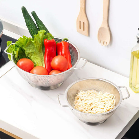 Stainless Steel Colander 3 Quart Strainer For Kitchen Food Prep Dishwasher Safe with vegetables and pasta on countertop