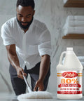 Heavy Duty Industrial Strength Vinegar Concentrate With Eighty Percent Acetic Acid For Tough Cleaning At Home And Outdoor Jobs Dilutes Easily Technical Grade Safe For Septic Systems 128 Ounce Bottle next to man cleaning floor