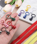 Various colored zipper sliders including green from 20 Pack Size 5 Zipper Sliders Metal Replacement With Pull Loop No Sewing Needed For Quick Fixes On Bags Wallets Jackets And Other Closed End Zippers In Green DIY Friendly.