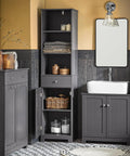Bathroom Tall Storage Cabinet Freestanding Tower With Shelves And Drawers Multifunctional Corner Unit For Small Spaces Gray Floor Standing Cabinet With Adjustable Shelves Space Saver in bathroom setting with towels and baskets