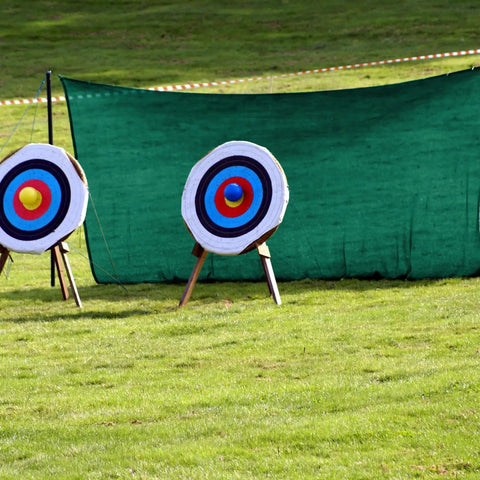 5x10 Foot Archery Backstop Net For Backyard Practice And Outdoor Target Shooting with reinforced netting and targets.